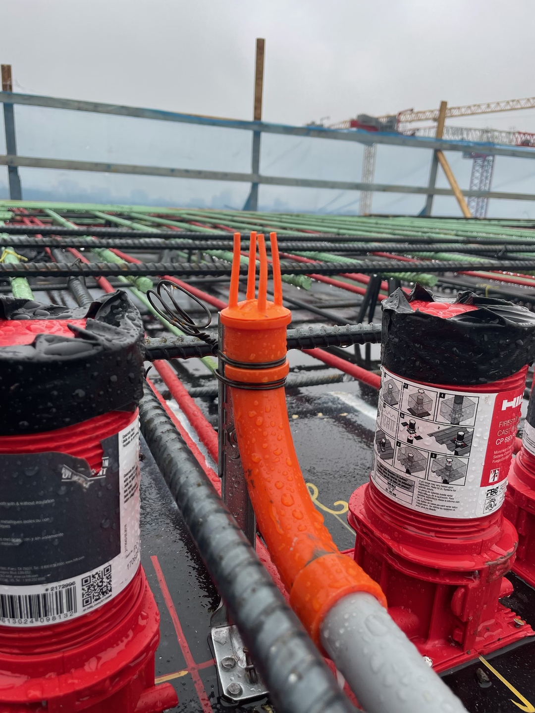 Close view of Stub-EASE II™ cap and Bend-EASE™ elbow installed between rebar on active deck